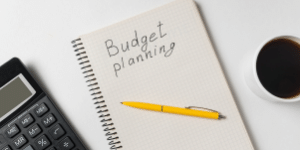 Image of note pad with the word budgeting on it