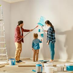 A family is painting their wall during a renovation paid for with a home equity loan. A family is painting their wall during a renovation paid for with a home equity loan.