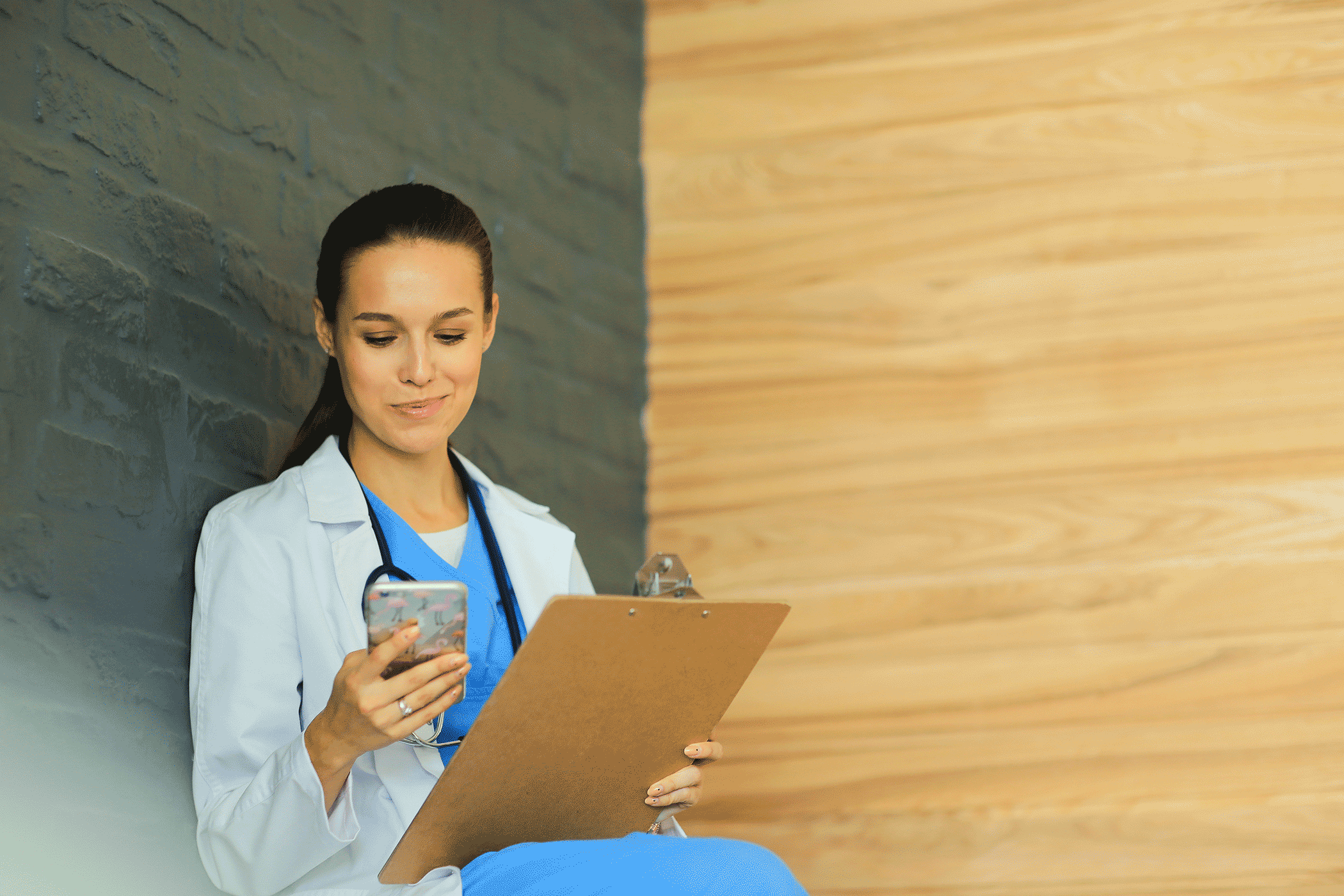 Woman looking at cell phone, smiling