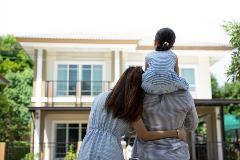 Happy family looking at new home